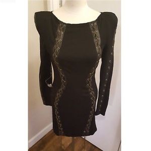 Black, chained Kardashian’s Bebe dress.